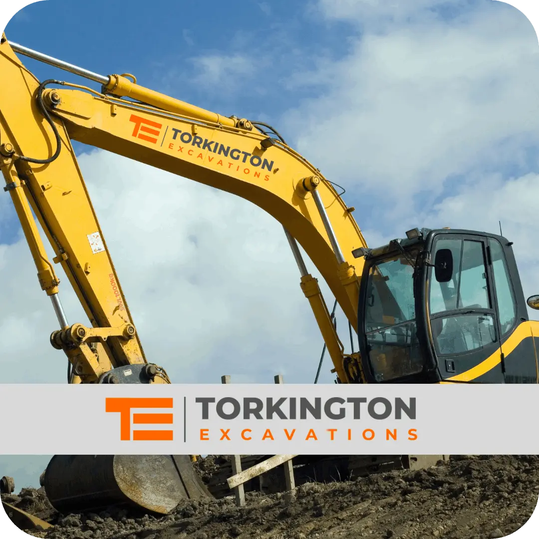 Mini digger carrying out excavation work in Stockport