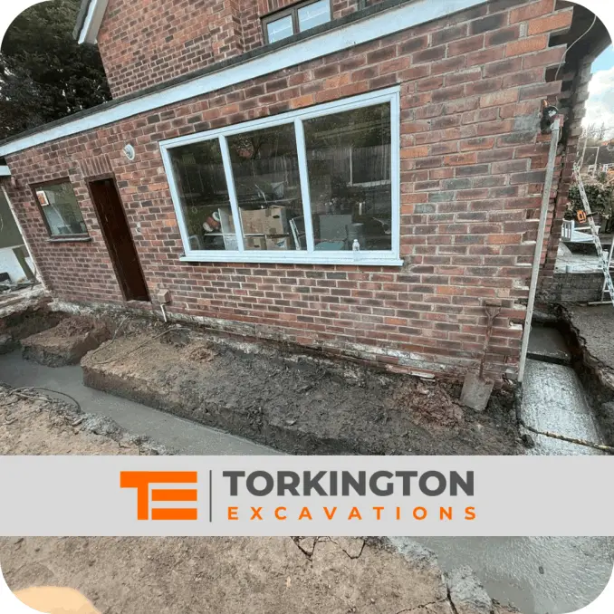 Concrete slab being poured and levelled on a residential project