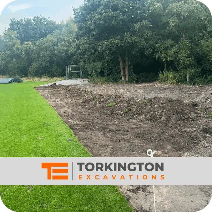 Groundworkers installing utility trench for water and electric services